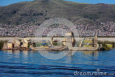 Weathered reed boats along the coast of Lake Titicaca in Puno, P Editorial Stock Photo