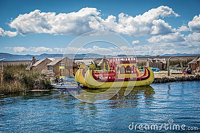 Weathered reed boats along the coast of Lake Titicaca in Puno, P Editorial Stock Photo