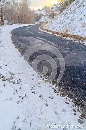 Weathered road on snowy mountain in Salt lake City Stock Photo
