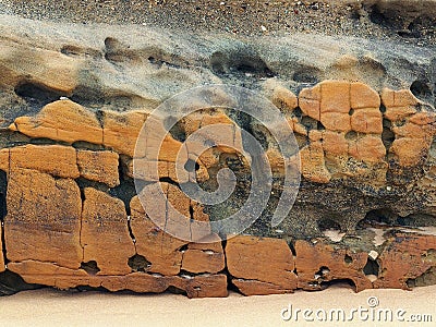 Weathered Rocks on Beach Stock Photo