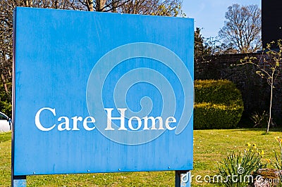 Weathered Sign for elderly people 'Care Home' at the entrance of Stock Photo