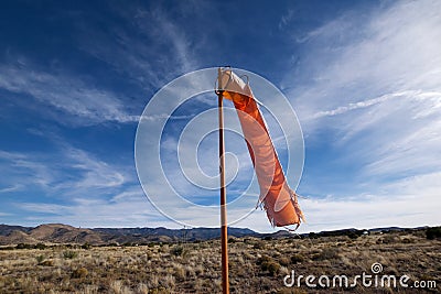 Wind sock at remote airfield Stock Photo