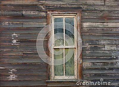 Weathered window on old west building Stock Photo