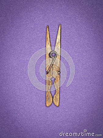 A weathered wooden clothes peg photographed with a ring flash Stock Photo