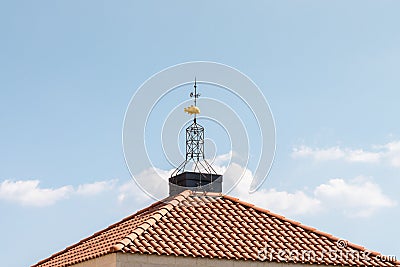 Weathervane in the form of gold fish on the roof of Tabgha - the Catholic Church Multiplication of bread and fish Editorial Stock Photo