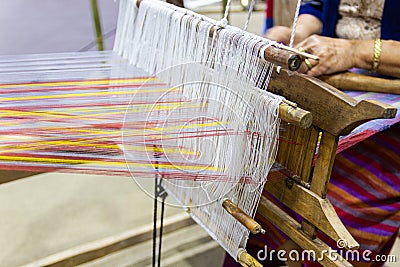 Weaving equipment Household weaving - Detail of weaving loom for homemade silk Stock Photo