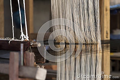 Weaving on a traditional Lao-Thai style loom Stock Photo