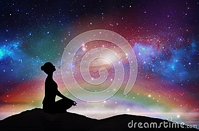 Mountain girl silhouette, meditation under stars Stock Photo