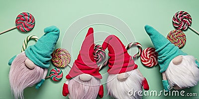 Web banner format. Snow gnomes or elves on a green background. Christmas toy Stock Photo