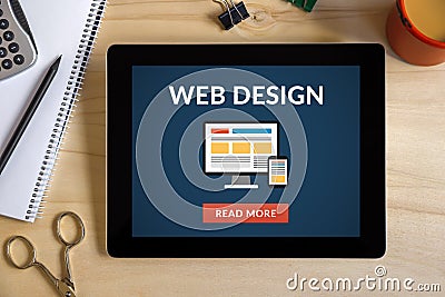 Web design concept on tablet screen with office objects Stock Photo