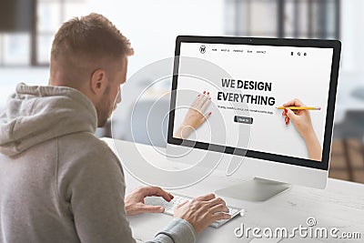 Web design studio with concept agency web page on computer display Stock Photo