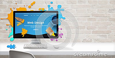 Web design studio concept with modern web site teme and web design text on computer display surrounded by color drops Stock Photo