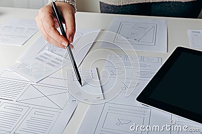 Web designer creating mobile responsive website Stock Photo