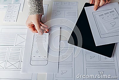 Web designer creating mobile responsive website Stock Photo