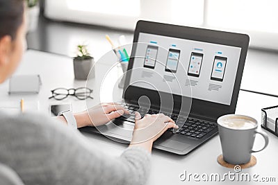 Web designer with laptop working on user interface Stock Photo