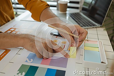 A web designer is using his idea to create a digital product design project that will meet the needs of users in terms of both Stock Photo