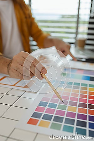 A web designer is using his idea to create a digital product design project that will meet the needs of users in terms of both Stock Photo