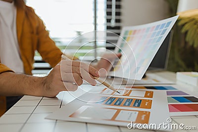 A web designer is using his idea to create a digital product design project that will meet the needs of users in terms of both Stock Photo