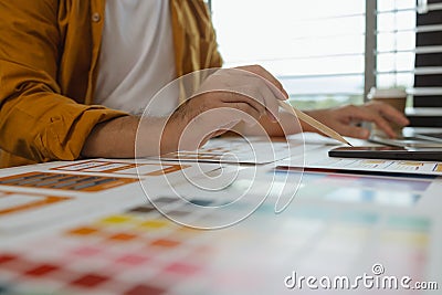A web designer is using his idea to create a digital product design project that will meet the needs of users in terms of both Stock Photo