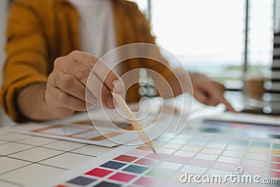 A web designer is using his idea to create a digital product design project that will meet the needs of users in terms of both Stock Photo