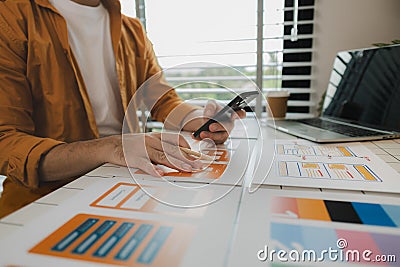A web developer, as a User Experience and User Interface Officer, is designing beautiful and easy-to-use digital products that Stock Photo