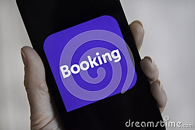 Web page with application Booking.com on smartphone Editorial Stock Photo