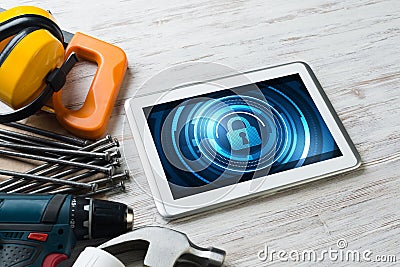 Web security and technology concept with tablet pc on wooden table Stock Photo