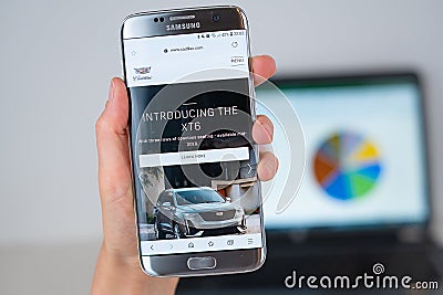Web site of Cadillac company on phone screen Editorial Stock Photo