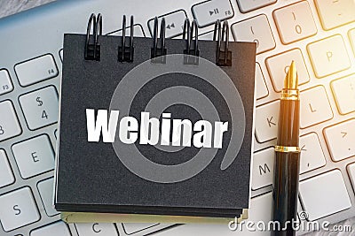 WEBINAR text with fountain pen and keyboard Stock Photo