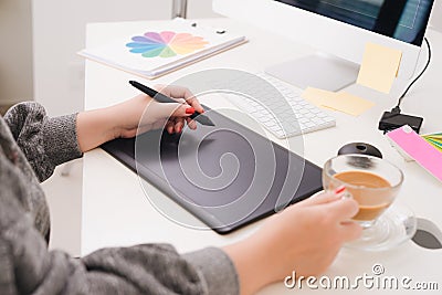 Website designer working digital tablet and computer laptop at d Stock Photo