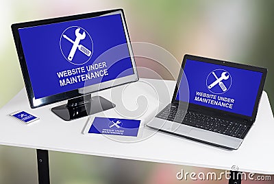 Website maintenance concept on different devices Stock Photo