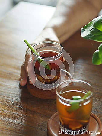 Wedang jahe (Indonesian ginger drink/tea) is made with ginger and many other spices/herbs. Stock Photo
