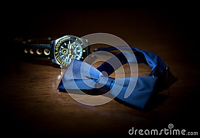 Wedding accessories. Butterfly to the groom`s suit and watch Stock Photo
