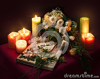 Wedding album for guests among flowers and candles Stock Photo