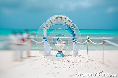 Wedding arch and musicians on the beach, artistic blur, lensbaby Stock Photo