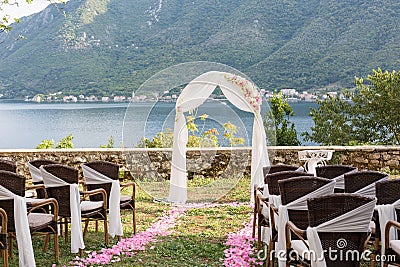 Wedding arch decorated with flowers outdoors Stock Photo