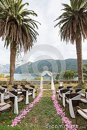 Wedding arch decorated with flowers outdoors Stock Photo