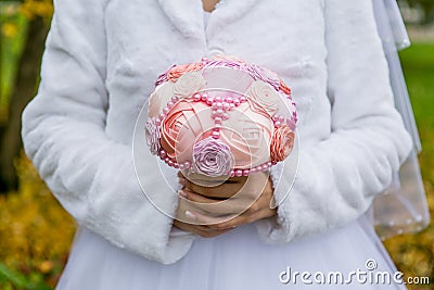 Wedding artificial bouquet in the bride hands Stock Photo