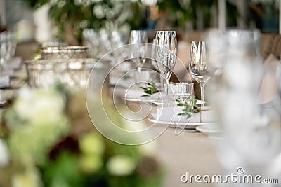 Wedding Banquet or gala dinner. The chairs and table for guests, served with cutlery and crockery. Covered with a linen Stock Photo