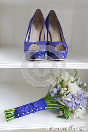 Wedding bouquet and bride shoes Stock Photo