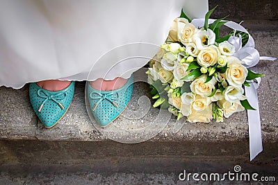 Wedding bouquet of flowers and bride's shoes Stock Photo