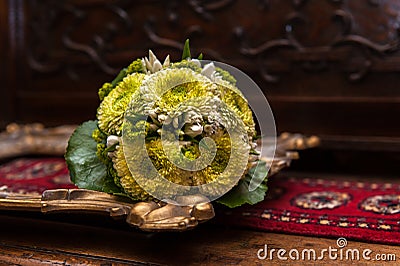 Wedding bouquet on a golden picture frame Stock Photo
