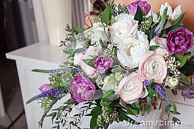 Wedding bouquet in hands of the bride Stock Photo