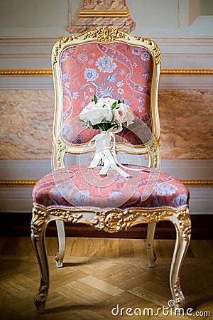 Wedding bouquet lying on chair Stock Photo