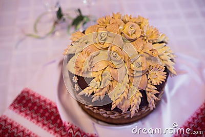 Closeup wedding loaf with flowers on a table. Wedding bread. Stock Photo