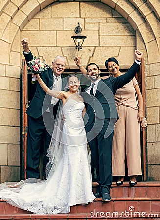 Wedding, bride and groom with parents on stairs, church and happiness at excited celebration. Marriage, couple and Stock Photo
