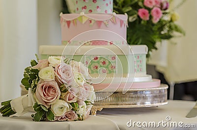 Wedding cake and bouquet Stock Photo