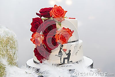Wedding cake on the bride`s desk Stock Photo