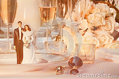 Wedding cake figurines on plate Stock Photo