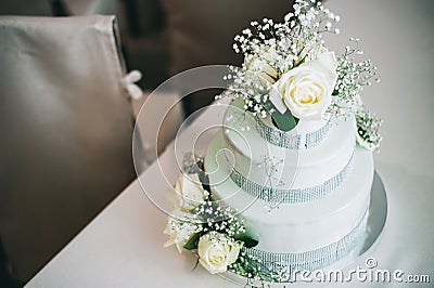 Wedding cake with flowers yellow beige red turquoise blue Stock Photo